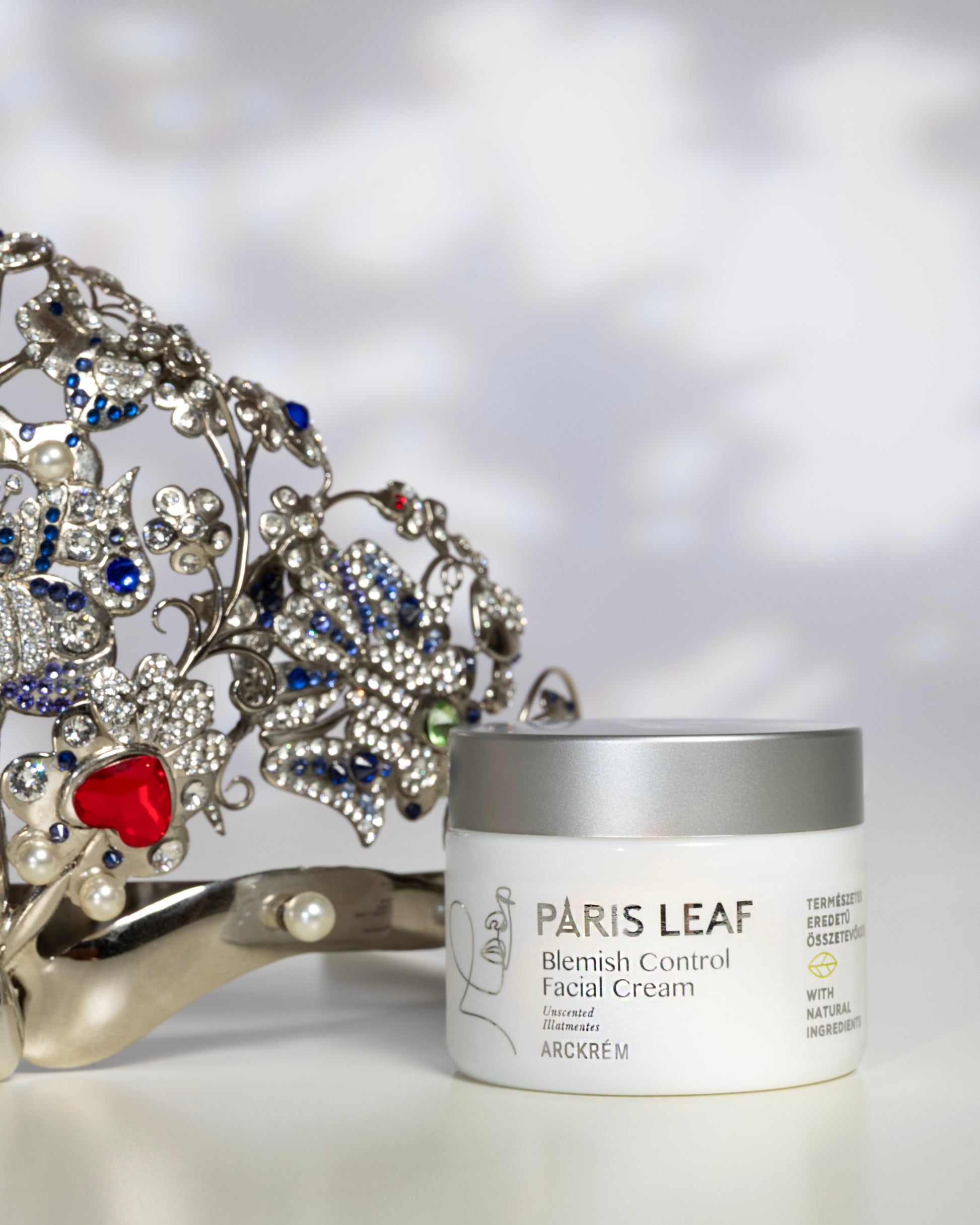 Parisleaf Blemish Control Facial Cream displayed beside the jeweled Miss Universe Hungary crown.